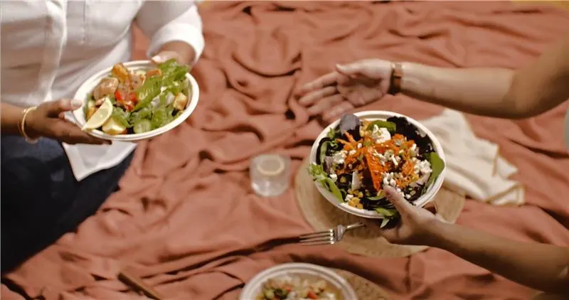 Two people eating food